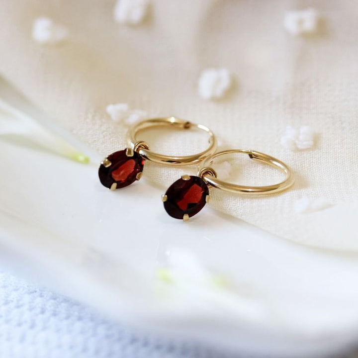 14K Yellow Gold Hoop Earrings with Oval Garnet Stones