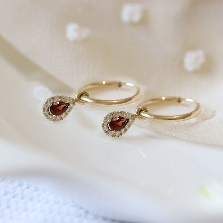 14k Gold Hoop Earrings with Halo Charms and Garnet Teardrop